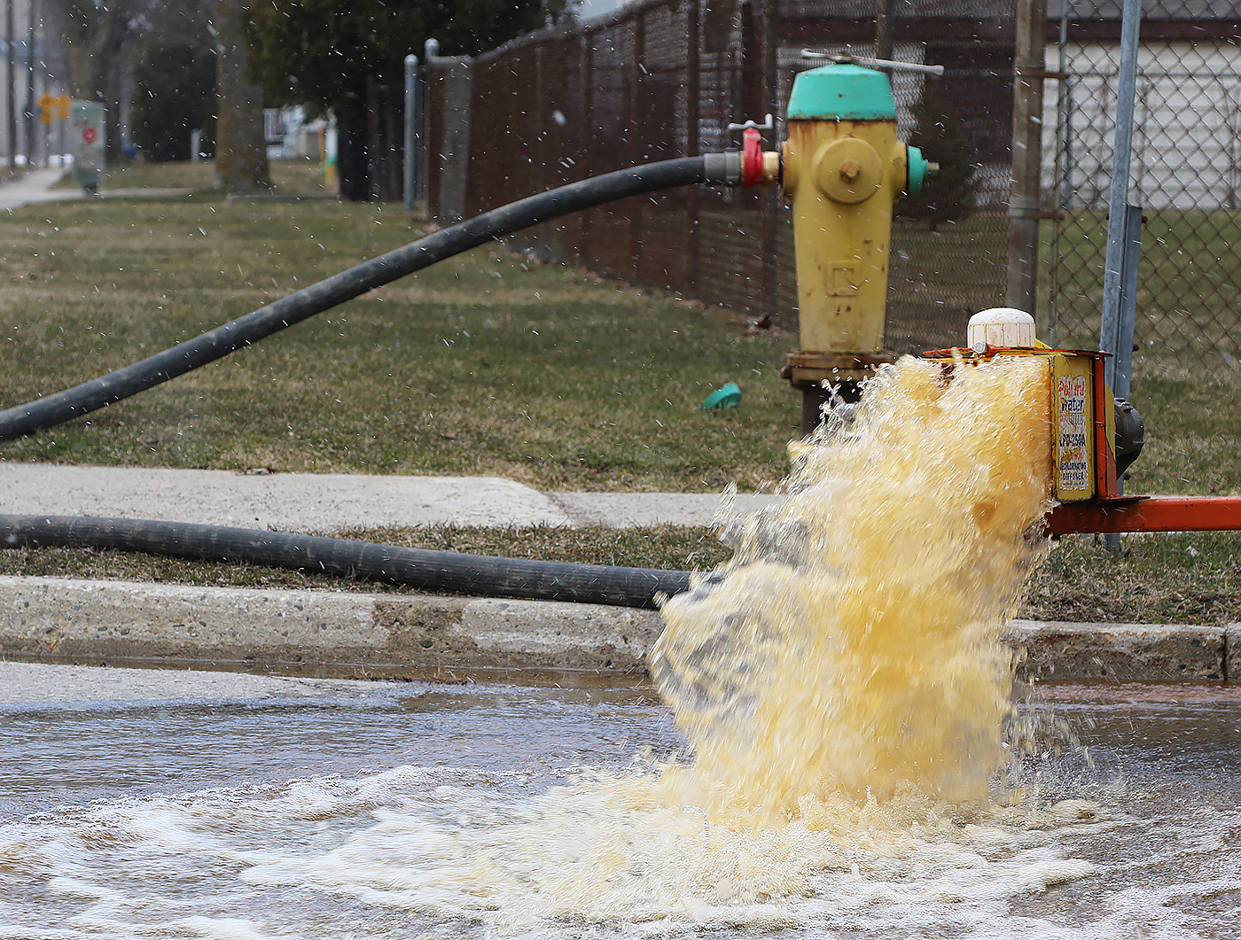 Discoloured water flowing from fire hydrant